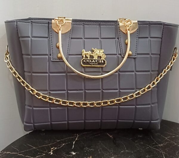 Grey quilted handbag with gold chain accents