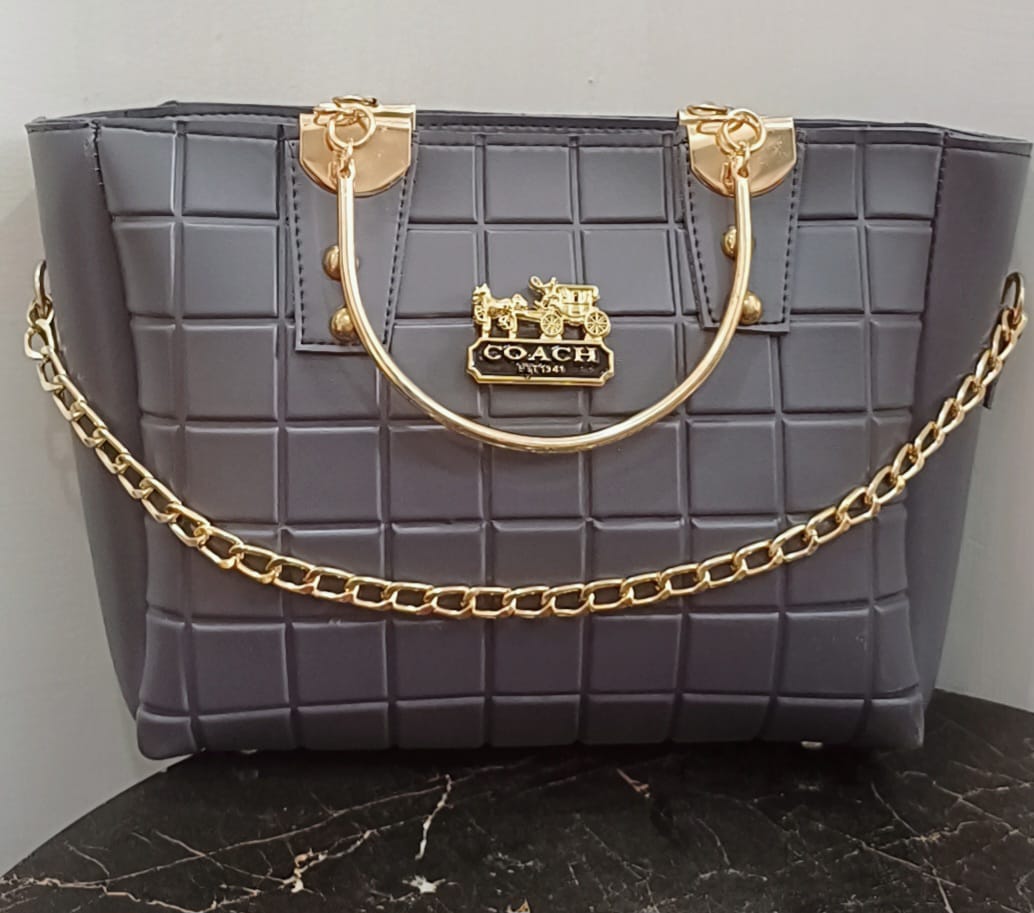 Grey quilted handbag with gold chain accents