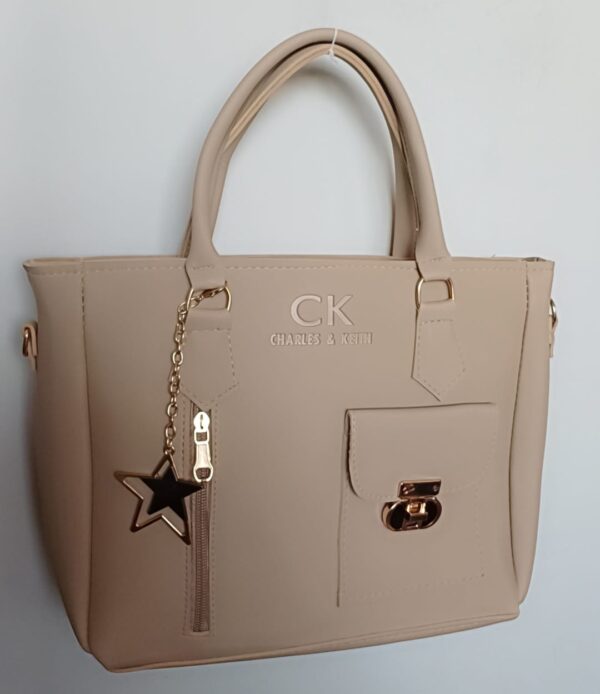 light beige tote handbag with gold star keychain and front pocket, Charles & Keith inspired – Zwore